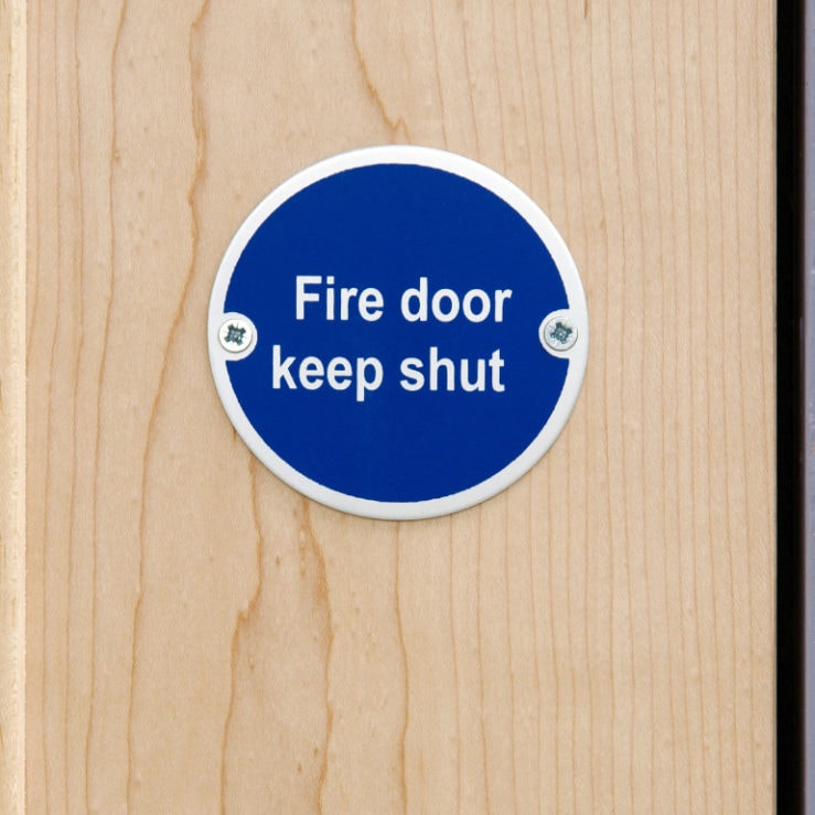 Fire door with Keep Shut sign on it Fire door with Keep Shut sign on it