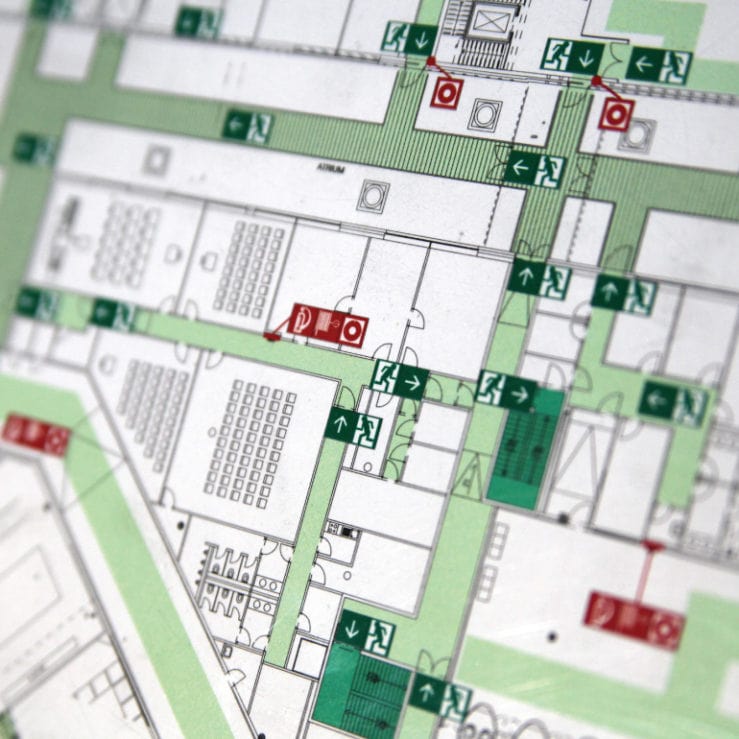 A fire evacuation plan of an office, with locations of fire exits and fire extinguishers.